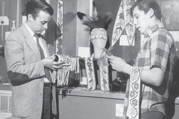 Examining beadwork in an early Ojibwe course at Bemidji State.