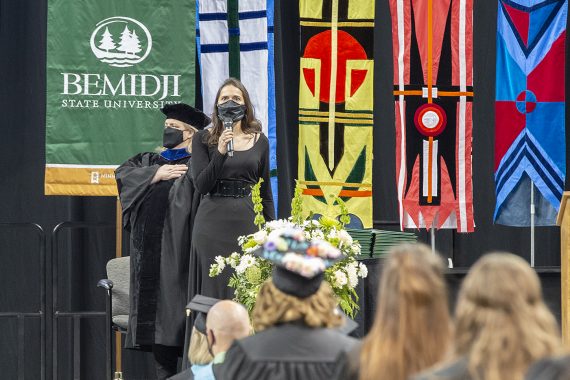 Assistant Professor of Music Dr. Jennifer Olson performing the national anthem