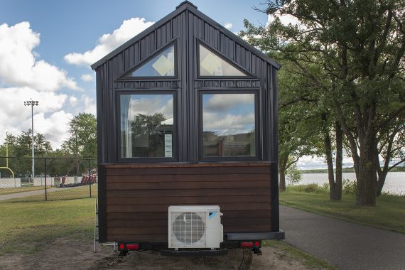 Bemidji State University tiny house Cedar beveled siding and black Pro Panel II Steel Siding.