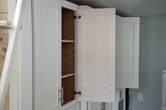 Bemidji State University tiny house Full-height kitchen cabinets.