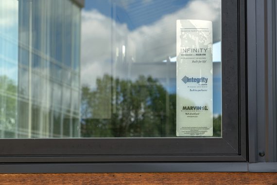 Bemidji State University tiny house Marvin Integrity Ultrex windows and patio door with ebony exterior and stone white interior (screens included).