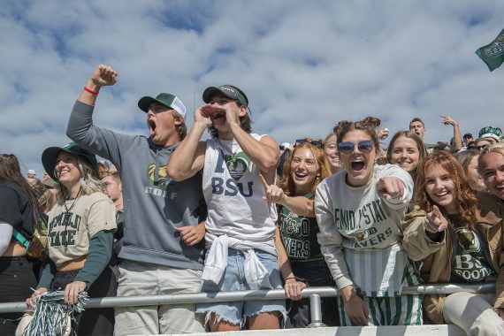 BSU students cheer on the football team in the stands.