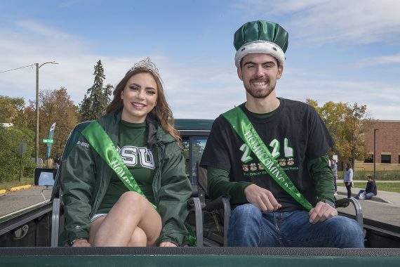 Homecoming king and queen join the parade.