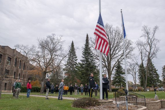 Presentation of colors and flag-raising ceremony at Bemidji State University’s flagpoles by Deputy Hall