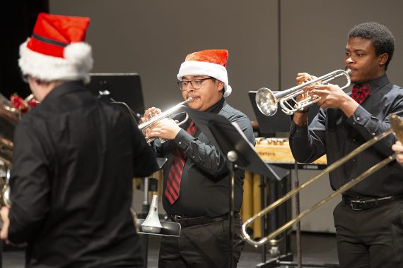 Bemidji State trombonists performing wearing holiday apparel during the 2021 Jingle Pops concert on campus