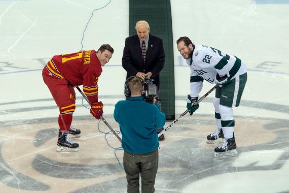 R.H. "Bob" Peters drops the puck during a hockey game