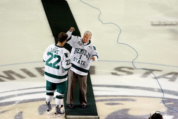 R.H. "Bob" Peters cheering on the Beavers on the ice