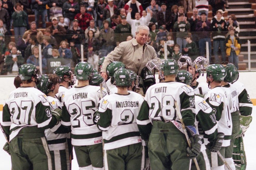 BSU Men's Hockey Team lifts Coach R.H. "Bob" Peters after the final game of his career in 2003