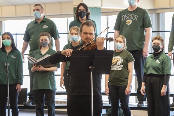 Eric Olson, assistant professor of music, performing with the Bemidji Choir. 