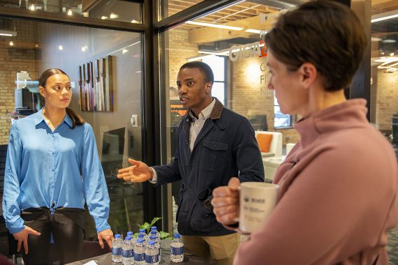 A student smiles at an entrepreneur
