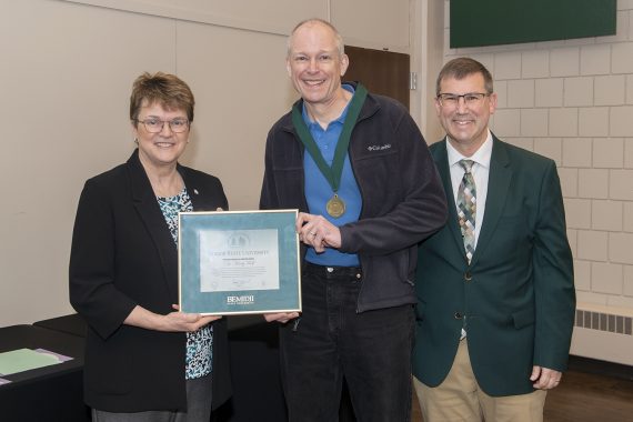 Dr. Marty Wolf, professor of mathematics and computer science, presented with emeritus gifts.