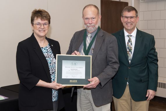 Dr. Mark Christiansen, professor of English, presented with emeritus gifts.