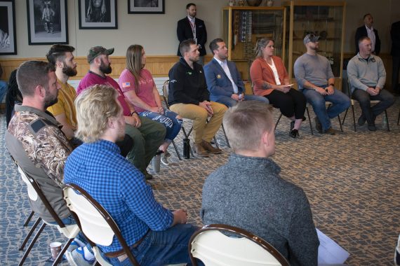 Student veterans sitting in a circle talking to United States Secretary of Veteran Affairs Denis McDonough