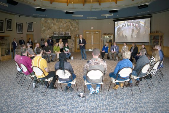 Student veterans sitting in a circle talking to United States Secretary of Veteran Affairs Denis McDonough