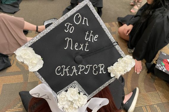 Bemidji State Class of 2022 graduation cap that says "On to the next chapter"