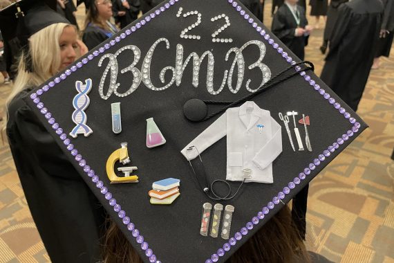 A graduation cap that says "'22 BCMB"