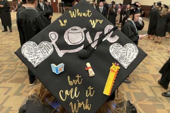 A graduation cap that says ""Do what you love, but call it work"