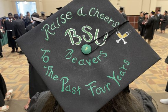Bemidji State Class of 2022 graduation cap that says "Raise a cheers to the past four years"
