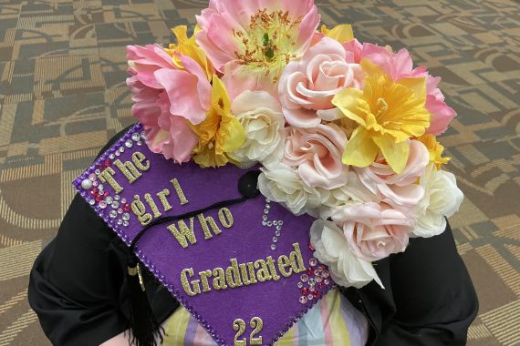 Bemidji State Class of 2022 graduation cap that says "the girl who graduated '22"