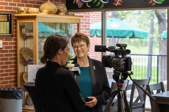 President Hensrud interviewing with a local reporter