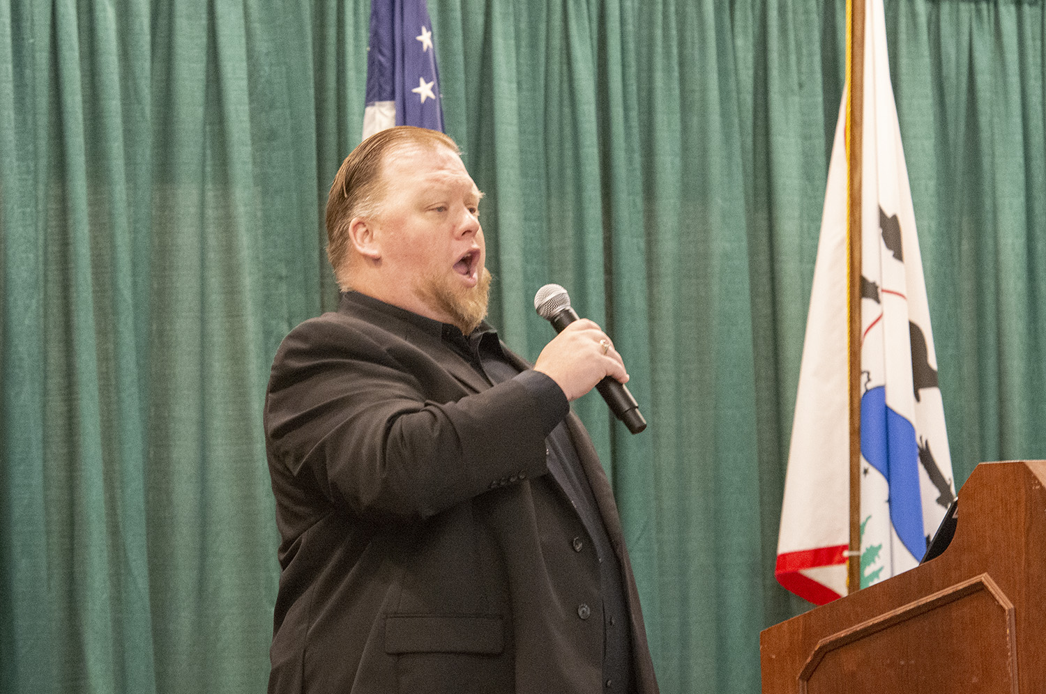 Dr. Cory Renbarger, professor of music, performs the National Anthem at the beginning of Bemidji State University's traditional Fall Startup Breakfast