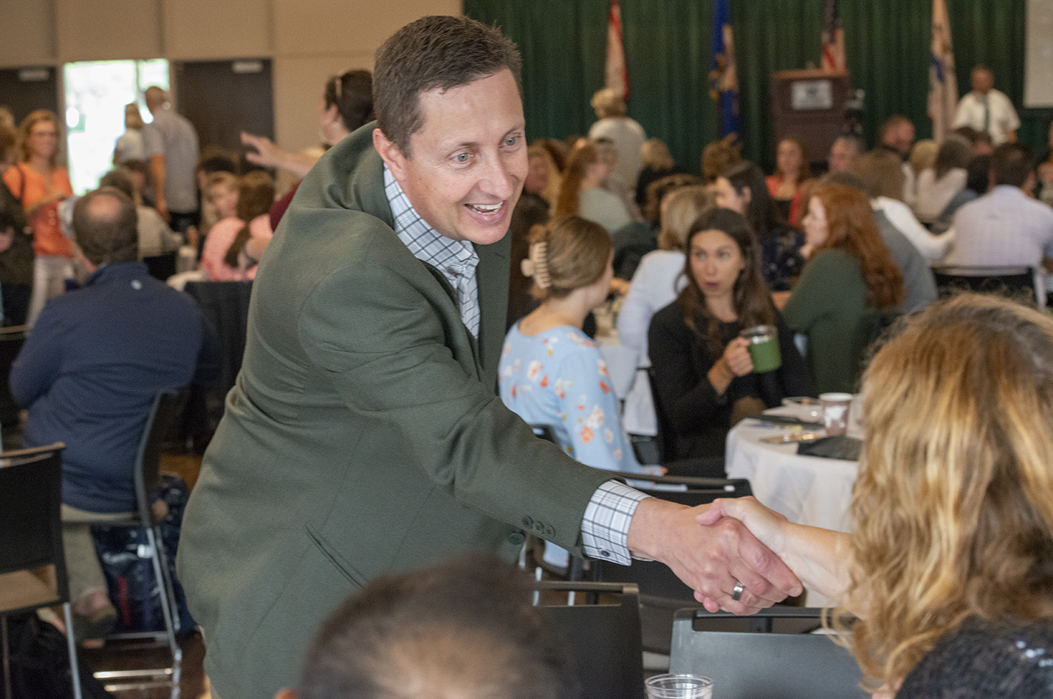 BSU President Dr. John Hoffman welcomes an attendee of the 2022-23 Fall Welcome Breakfast on August 16 in Beaux Arts Ballroom