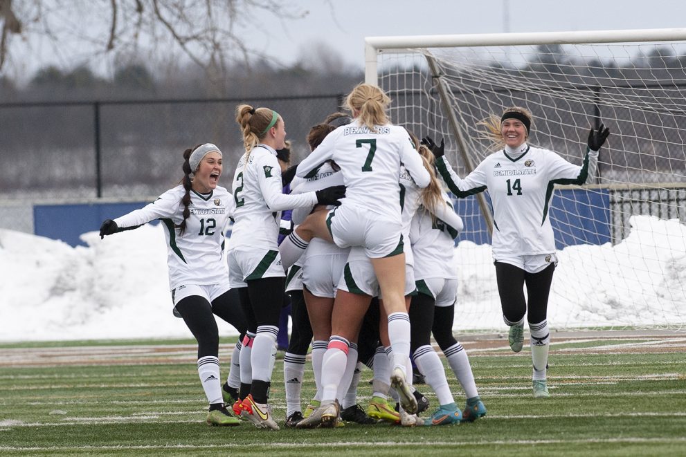 BSU Women's Soccer team hugging after a win in the 2022 NCAA Tournament