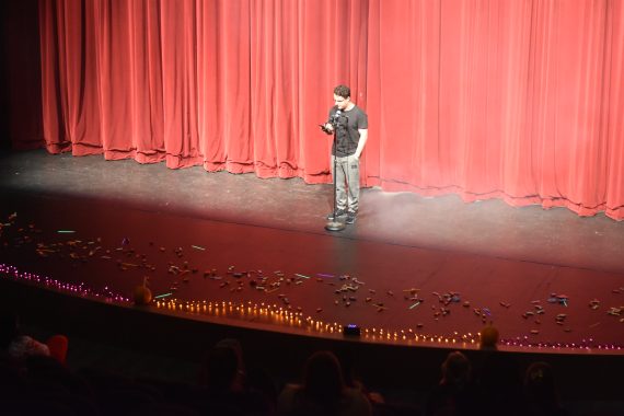 Student reading at the microphone