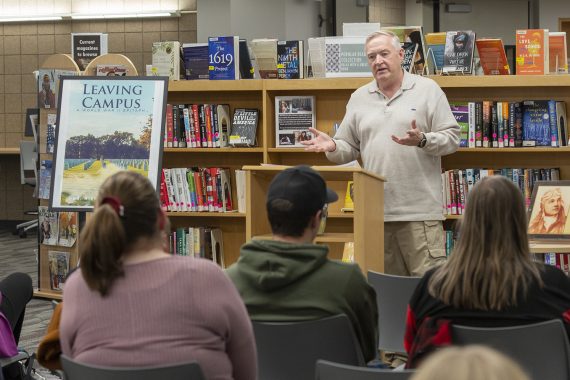 Dr. Mike Herbert reads from his book "Leaving Campus: A WWII Epitaph" on Nov. 9
