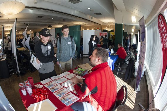 A student interacts with an employer at the career and internship fair at BSU