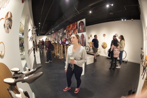 A BSU student looks at the works created by Steve Sundahl as part of the "Down the Rabbit Hole" exhibit in the BSU Talley Gallery