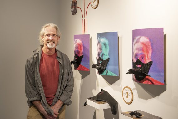 Steve Sundahl, artist behind the "Down the Rabbit Hole" exhibit, poses for a photo