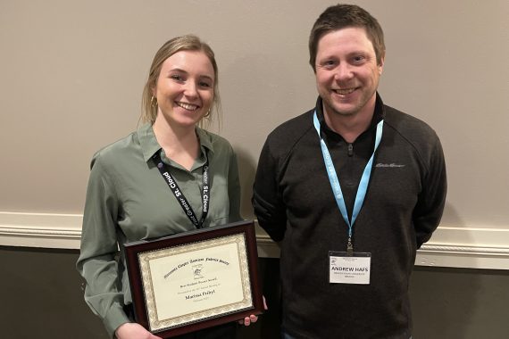 Marissa Pribyl stands next to BSU professor of aquatic biology Dr. Andrew Hafs