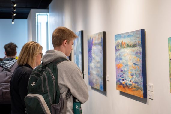 A BSU student looks at a painting on display in the Talley Gallery on April 4