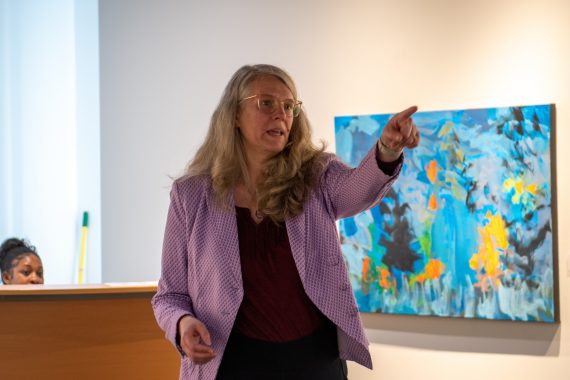 Gillian Bedford speaks to art gallery attendees