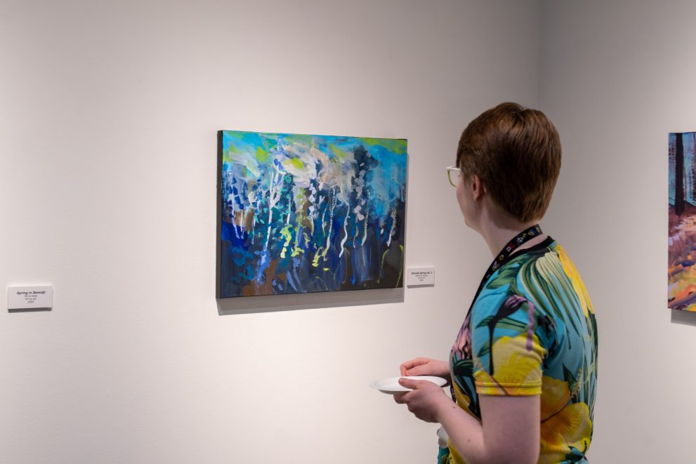A BSU student looks at a painting on display in the Talley Gallery on April 4
