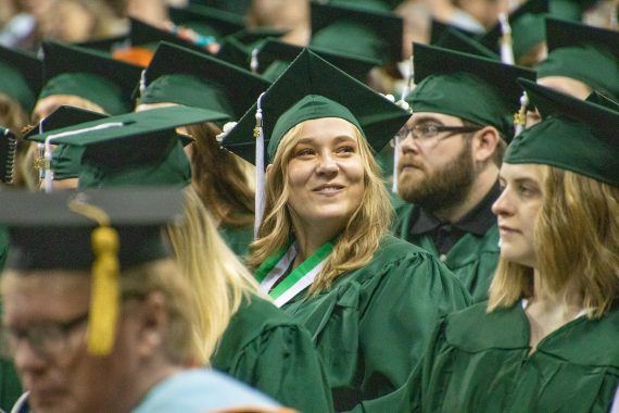 A BSU graduate smiles during commencement