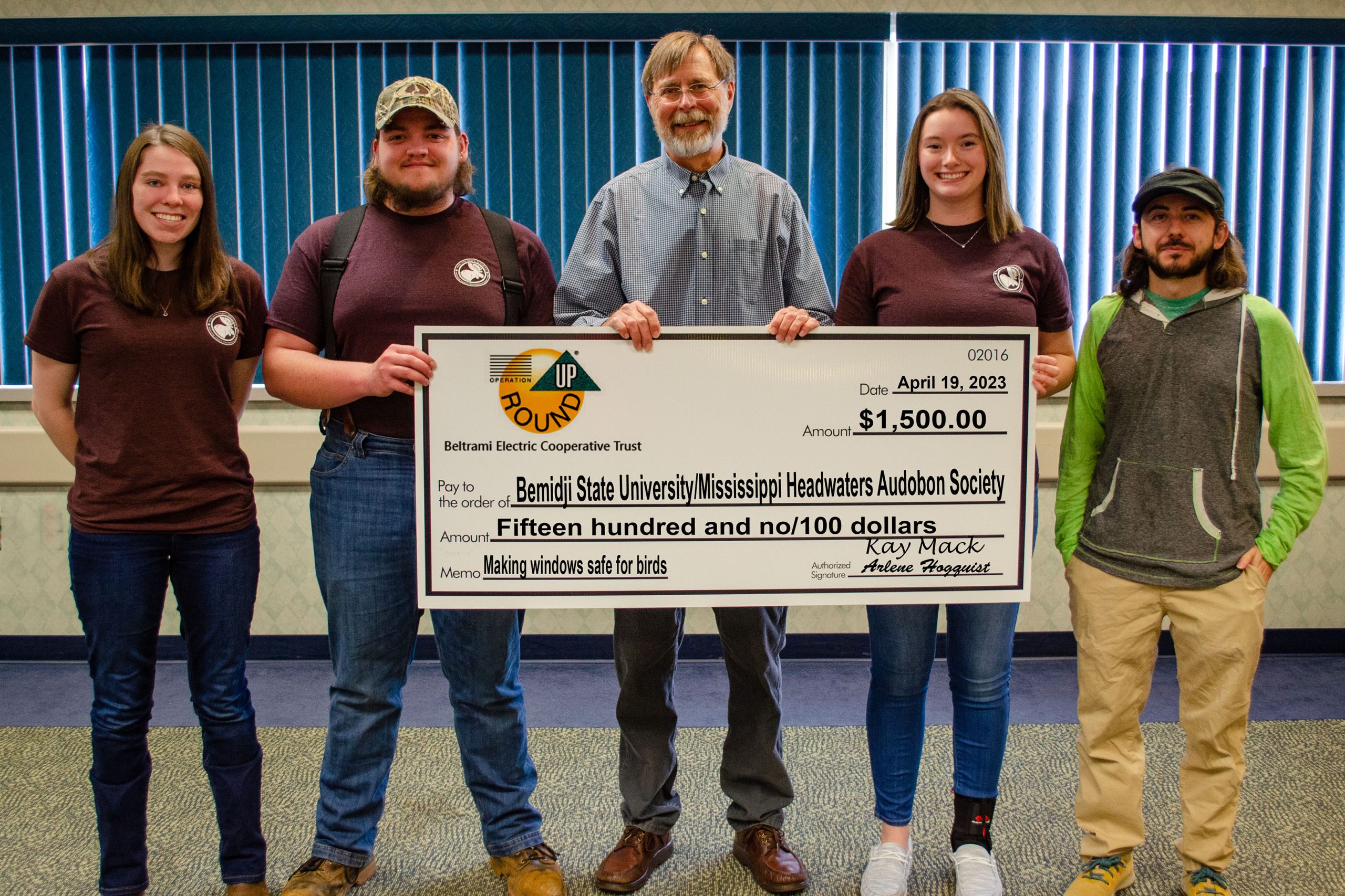BSU students with a check from $1,500 check from Beltrami Electric Cooperative