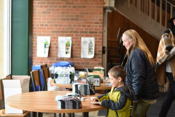 A young boy at a snack table