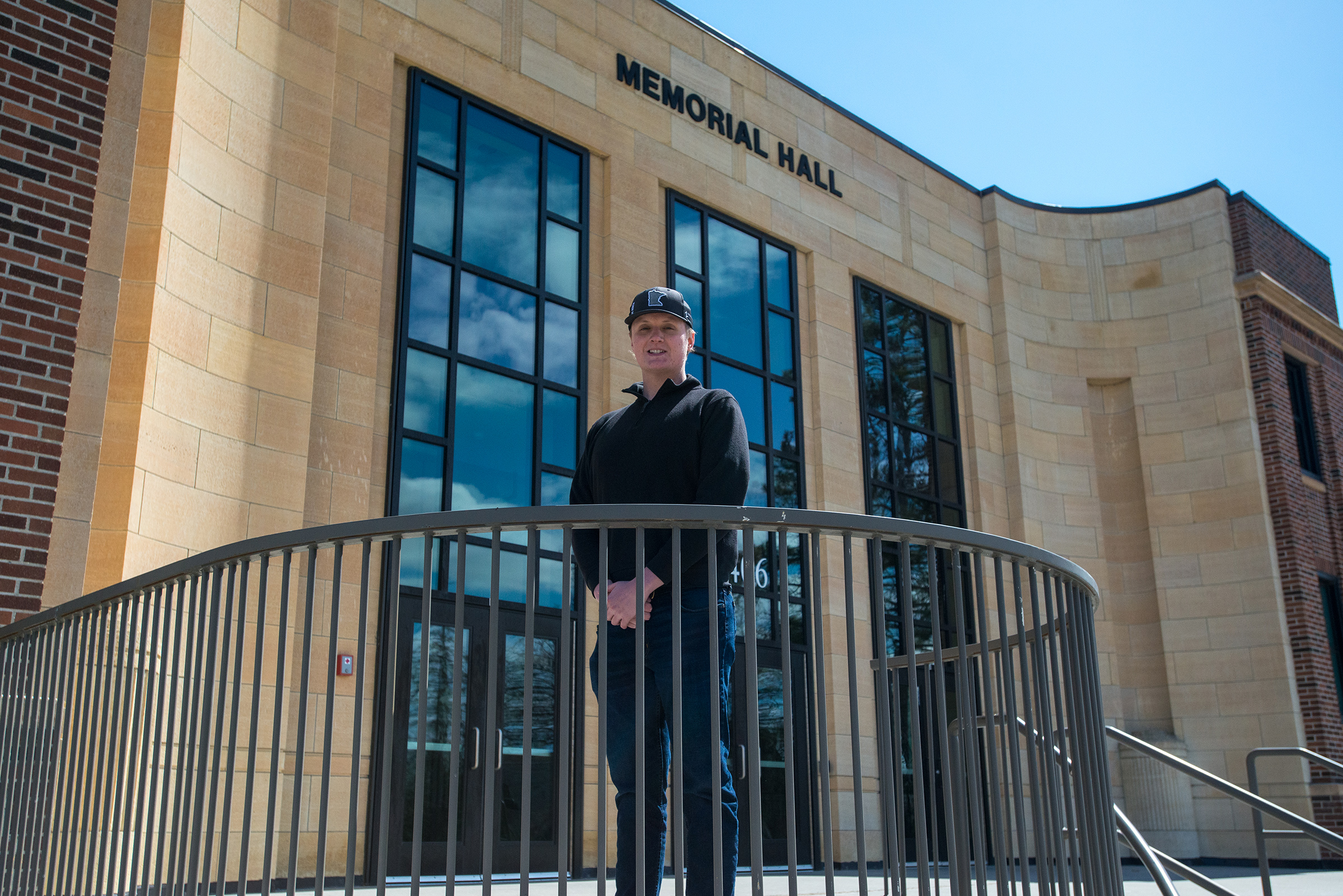 Jack Lundgren stands in front of Memorial Hall on the BSU campus