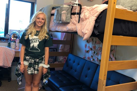 Bre poses in her dorm room in Birch Hall