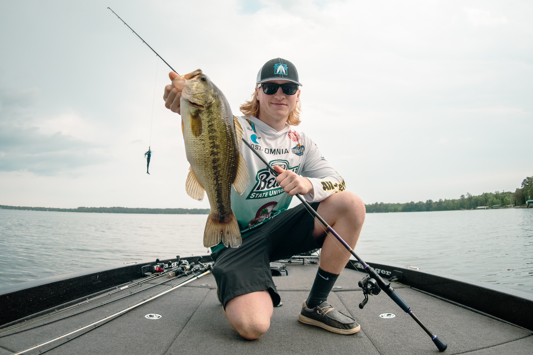 Nick Kolodziejski holds a largemouth bass