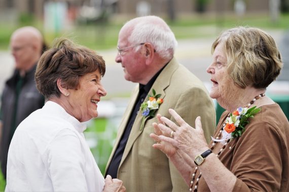 Nancy Bensen speaks with Mary Lou Peters, wife of the late BSU hockey coaching legend R.H. "Bob" Peters.