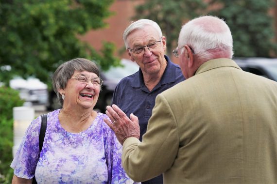 Jim Bensen greets guests at his farewell reception.