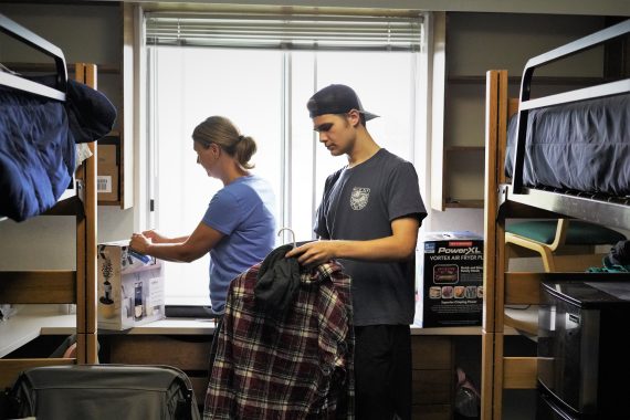 A student moves into their residence hall room at BSU