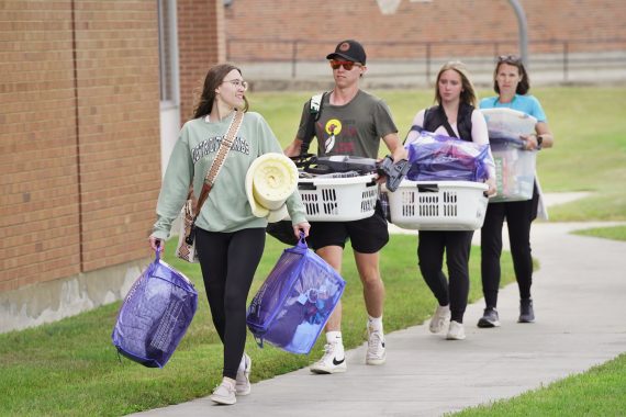 A student moves into their residence hall room at BSU