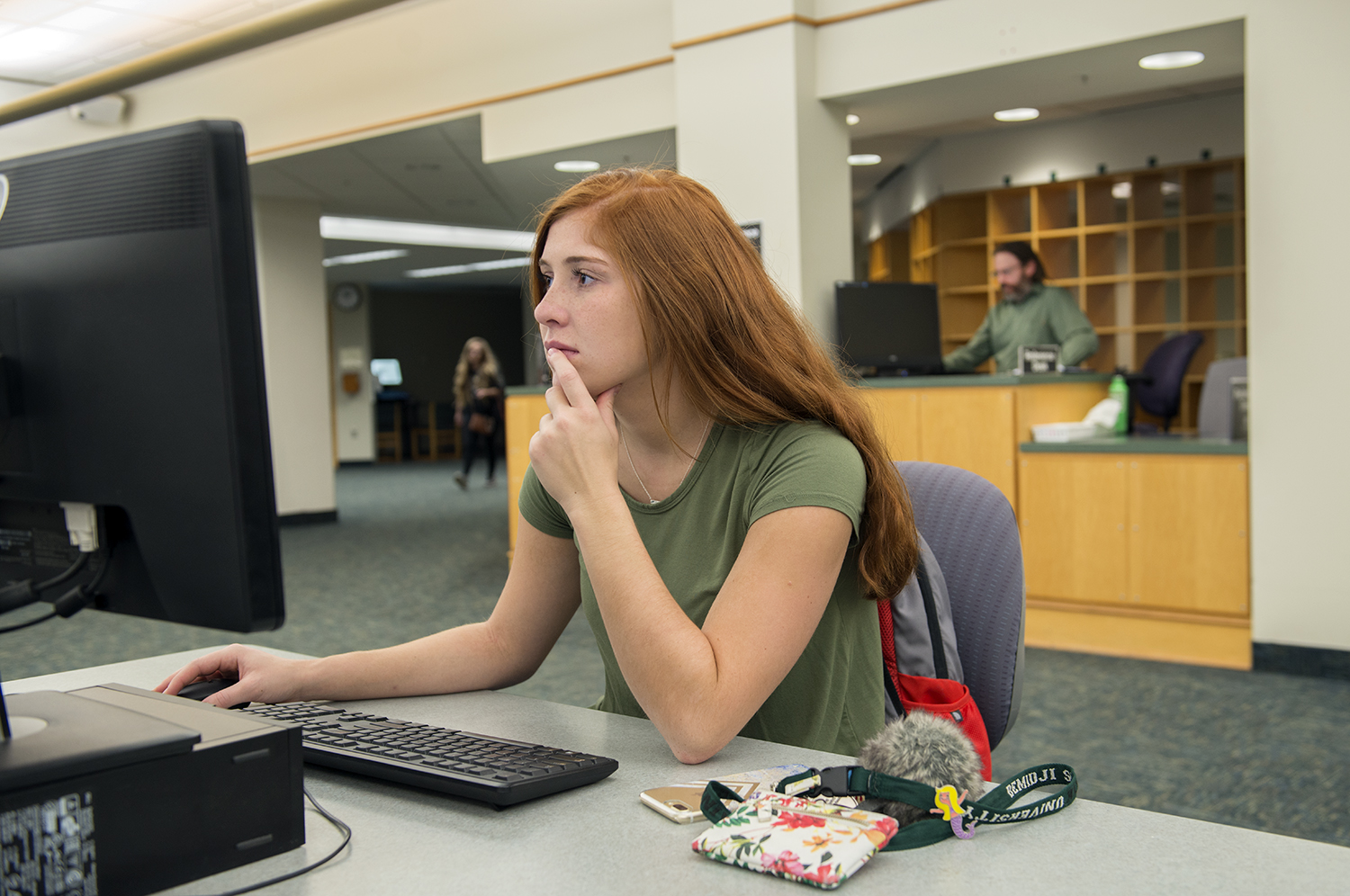 A student works on a computer in the A.C. Clark Library