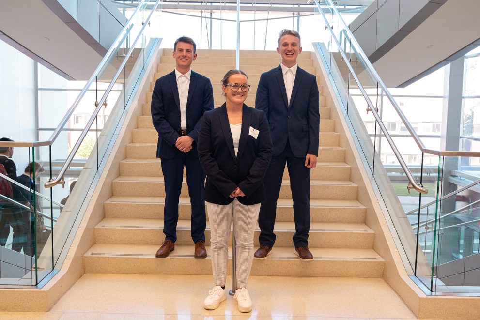 BSU students pose on a stairwell at the University of Nebraska for the Nebraska Case Competition.