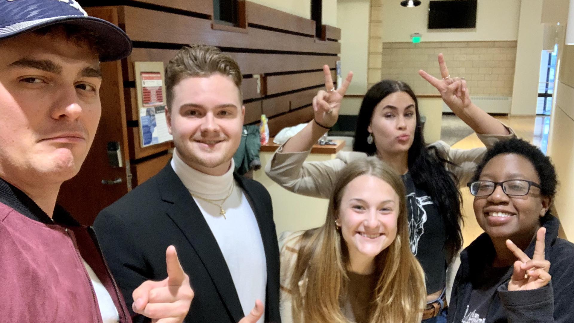 A group of five students taking a selfie.