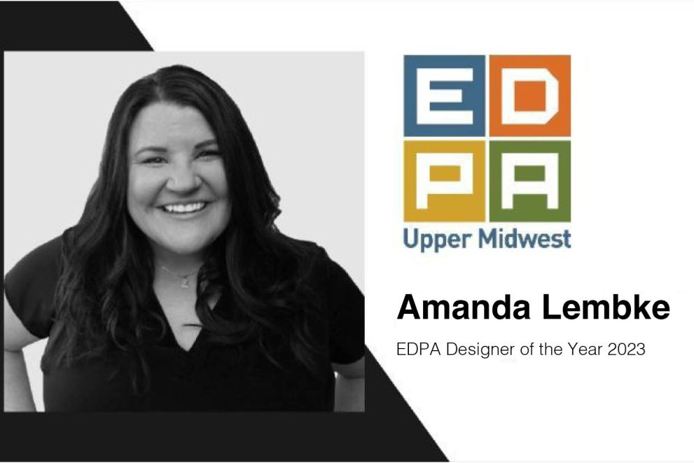 A black-and-white photo of a woman next to the Experiential Designers and Producers Association logo which says "Amanda Lembke EDPA Designer of the Year 2023"